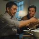 Elderly gay lovers Pak (right) and Hoi share a dinner together in 'Suk Suk'.